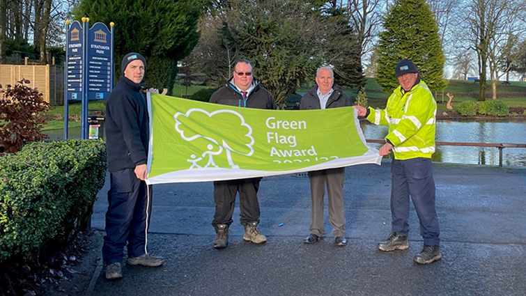 Strathaven Park Green flag with Community and Enterprise Committee Chair Councillor John Anderson, grounds team Matthew Burns and Stephen Sneddon and street cleansing's Duncan Stewart 