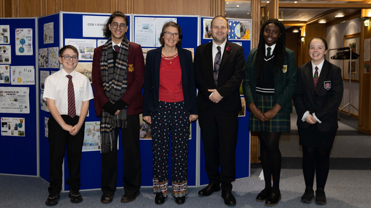 This image shows the chair and depute chair of the Climate Change and Sustainability Committee with young people ahead of their presentation to the committee