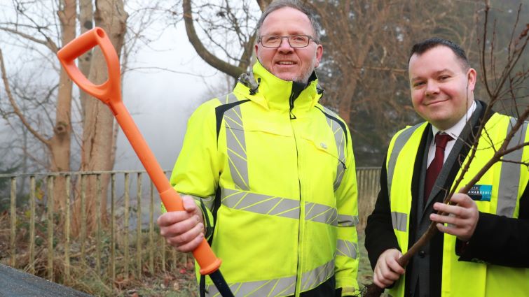 This image shows Council Leader Joe Fagan with a council worker holding a shovel and both wearing hi-vis vests 