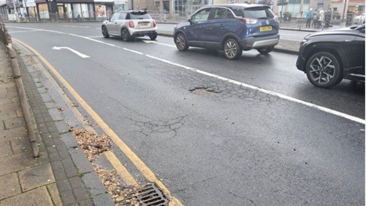 This image shows a pothole in Duke Steet in Hamilton