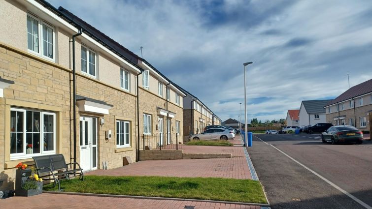This image shows a row of new council homes at Jackton in East Kilbride