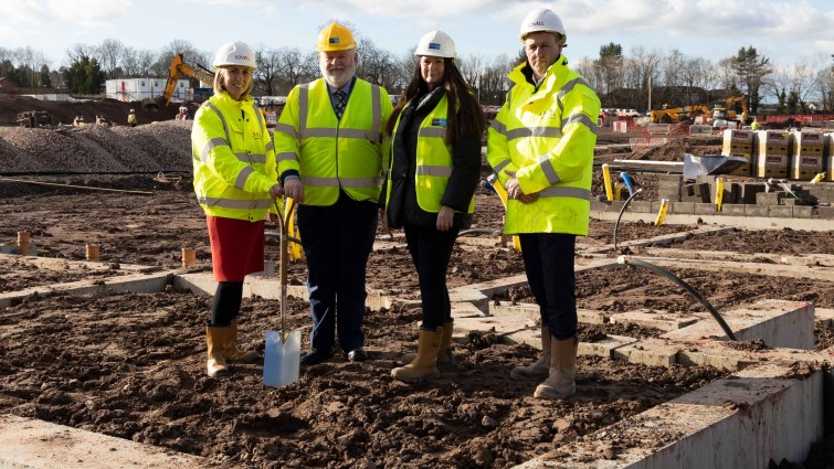 This image shows Councillor Davie McLachlan and Annette Finnan from Housing and Technical Resources with representatives of Lovell as work starts at the former Philips factory site 