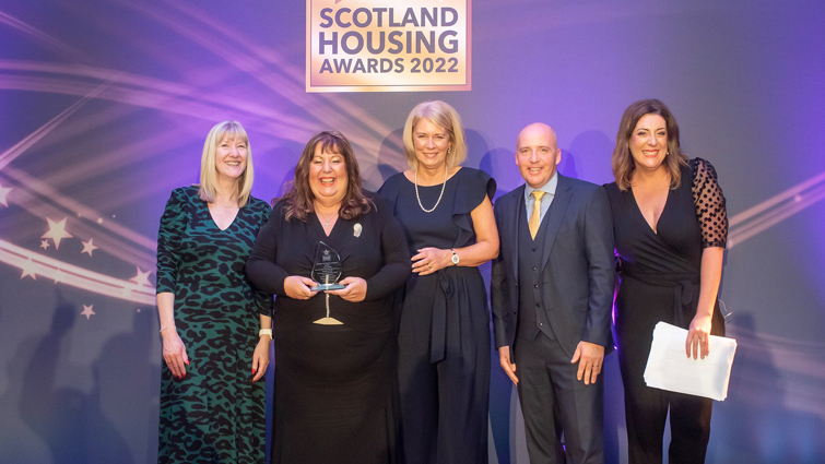 This image shows the council team receiving their award at the Scottish Housing Awards 2022 