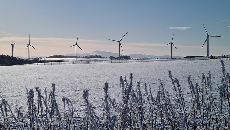 This image shows a view of one of South Lanarkshire's windfarms with a snowy setting 