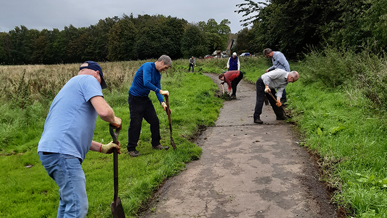 A group of volunteers working at South Haugh helping improve the biodiversity of the area 