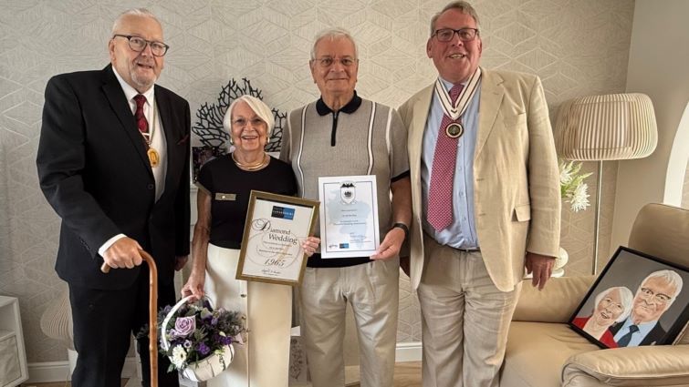 This image shows Mr and Mrs Reid with depute Provost Bert Thomson and Deputy Lord Lieutenant for Lanarkshire Dr William Morrison Young on the occasion of their Diamond Wedding Anniversary