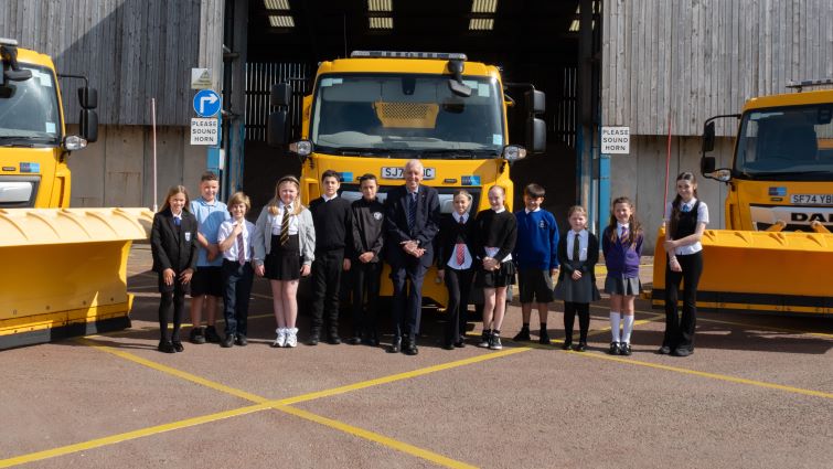 Councillor Robert Brown with the winners of the gritter-naming competition.
