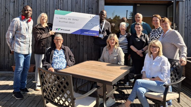 Members of Larkhall and District Volunteer Group with the charity's new garden furniture from McConnell through the Community Wish List.