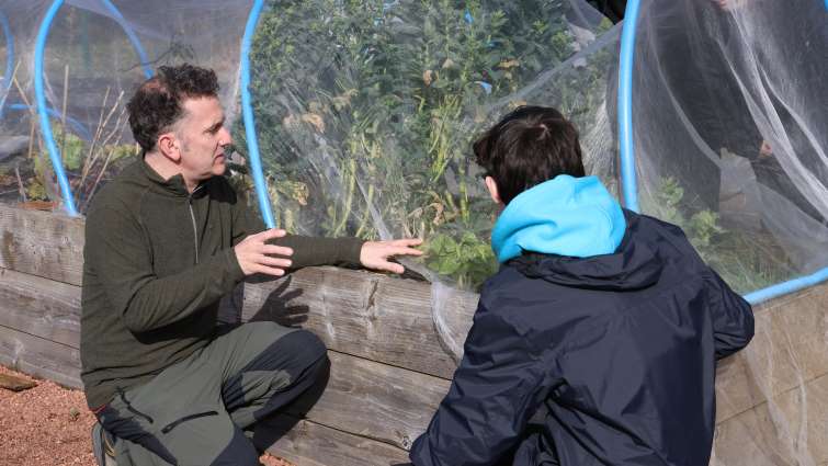 Lesmahagow High School pupil discussing gardening at local allotments
