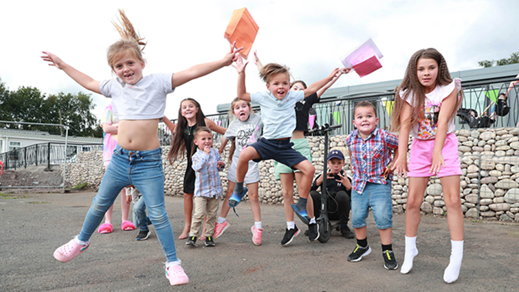 This image shows young people at the gypsy/traveller site in Larkhall