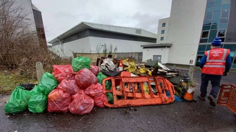 local litter picking group with bags of rubbish piled up waiting to be uplifted by council