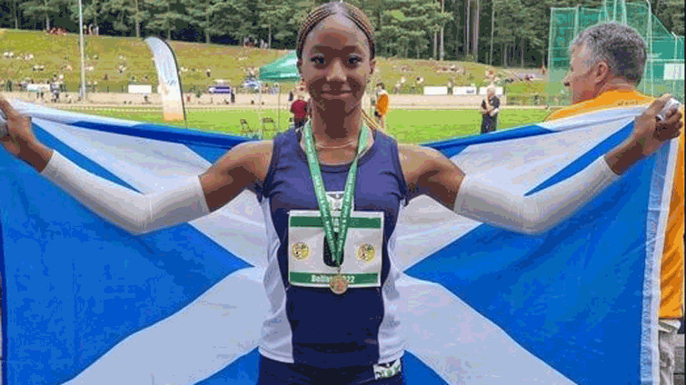 Tehillah Chioma Ikechukwu Okonkwo (u15 age) after winning the gold medal for Scotland in the u17 200m at the Schools International Track and Field Championships, in Belfast, in July 2022.