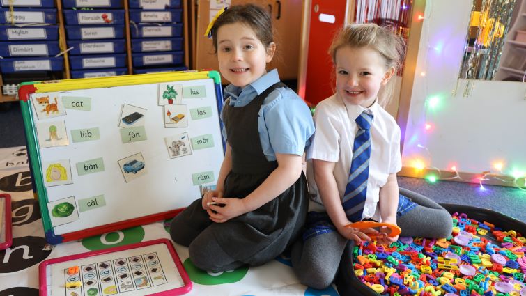 This image shows two pupils from Mount Cameron Primary School where Gaelic is taught