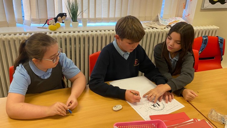 This image shows pupils from St John the Baptist Primary School having fun learning