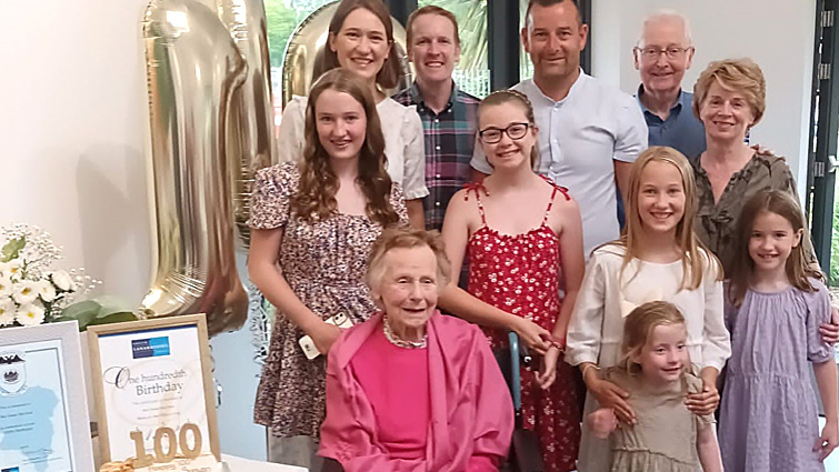 Susan McAleer's family gather with her for her 100th birthday.