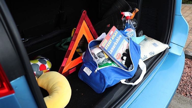 This is a photo of an emergency kit in a car boot