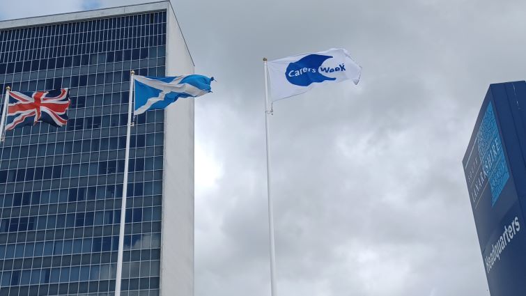 The Carers Week flag flying outside SLC HQ in June 2026.