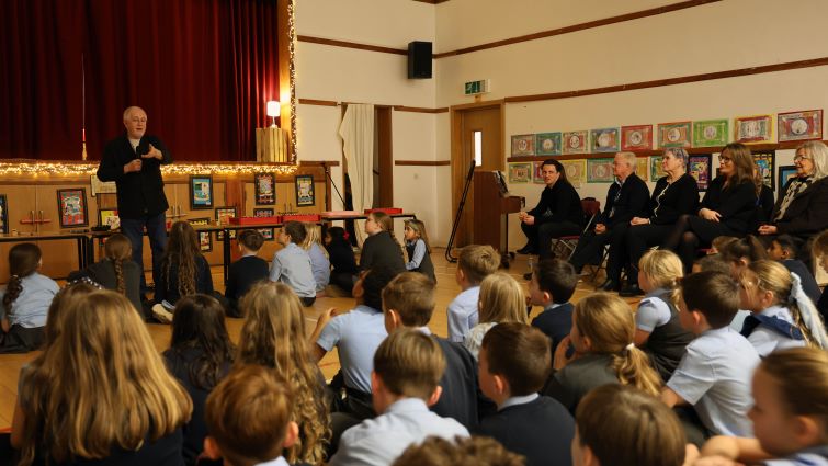 Holywood composer and former pupil Patrick Doyle talks to pupils at St John the Baptist PS, Uddingston.