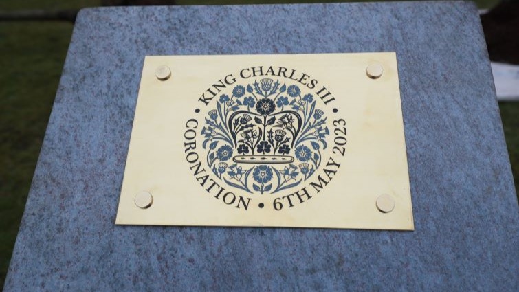 The plaque at the Coronation Tree, outside SLC HQ, Hamilton.
