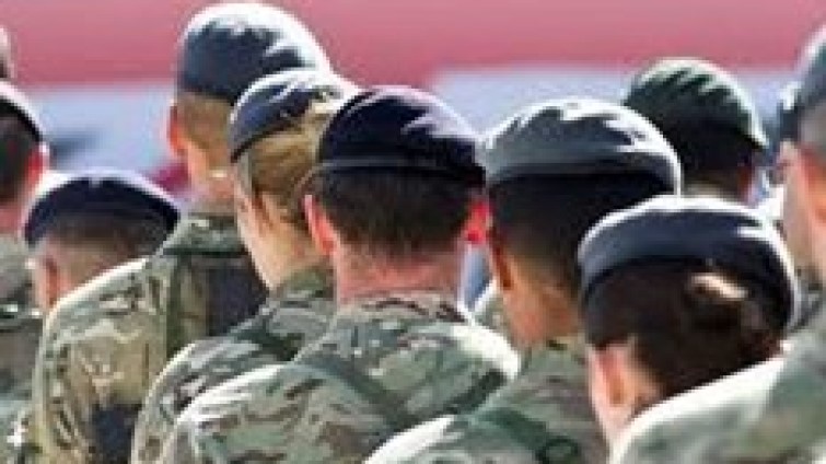 A general shot of British Army soldiers, taken from behind.